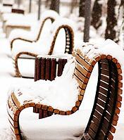 Wooden park bench in a sunny day - winter time [IBR123380161]
