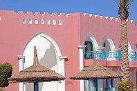 Arabic architecture: red walled building [IBR123380176]