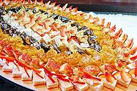 Cakes with tropical fruits at the table [IBR123380188]