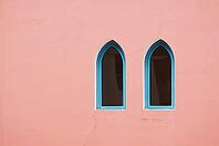 Arabic architecture: two windows on the red wall [IBR123380192]