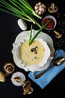 Soup with mushrooms and cream sour on rustic background with copy space [IBR123380202]