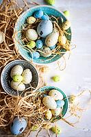 Easter holiday card with variety of easter eggs on white rustic background with copy space [IBR123380203]