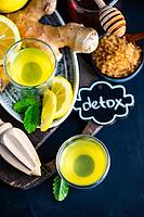 Detox drink with organic lemon, ginger and mint on dark background with copy space [IBR123380214]