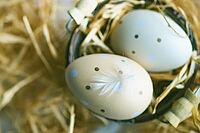 Easter holiday card with variety of easter eggs on white rustic background with copy space [IBR123380215]