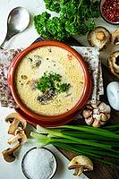Soup with mushrooms and cream sour on rustic background with copy space [IBR123380217]