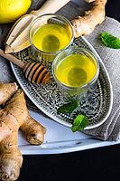 Detox drink with organic lemon, ginger and mint on dark background with copy space [IBR123380218]
