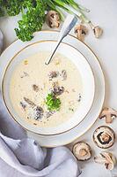 Soup with mushrooms and cream sour on rustic background with copy space [IBR123380219]