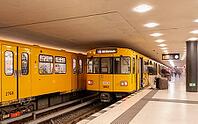 Dynamic scene of a Berlin underground in typical yellow colour, long exposure with blur effect, busy traffic junction at Unter den Linden station, Berlin, Germany [IBR112672611]