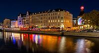 Night photo on the banks of the Spree opposite the Schiffbauerdamm, urban environment with scene locations at the Berliner Ensemble theatre, reflections of the night lighting appear in the water of the Spree, Berlin, Germany [IBR112672615]