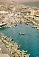 View from cable car of boats and buildings in fishing port, Barceloneta area of Barcelona, Spain, Europe 1965 [IBR112672625]