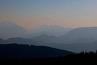View from Austria to the Berchtesgaden Alps with Hohem Göll, Watzmann, Hochkalter and Untersberg in hazy evening light, Upper Bavaria, Bavaria, Germany [IBR123435195]