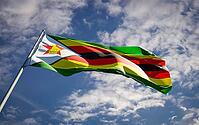 Beautiful national state flag of Zimbabwe fluttering at sky background. Low angle close-up Zimbabwe flag 3D artwork [IBR123569286]