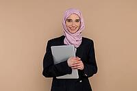 Business woman. Cute young business woman with a laptop [IBR123569314]