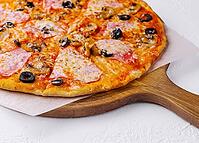 Food, Pizza with ham and mushrooms on a light background [IBR123622454]