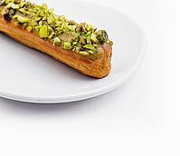 Food, Delicious eclair with pistachio and cream [IBR123622477]