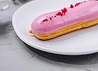 Food, Eclairs with glaze on a white plate [IBR123622479]