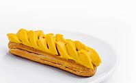 Food, Eclair with Mango Cream on White Plate [IBR123622481]