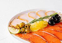 Food, Salmon, white fish and olives on plate [IBR123622484]