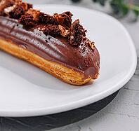 Food, Eclair with Chocolate Cream and Hazelnuts closeup [IBR123622491]