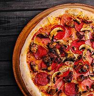 Food, Pepperoni pizza with mushrooms on wood background [IBR123622494]