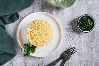 Traditional layered salad with canned fish on a plate on the table top view [IBR123629684]