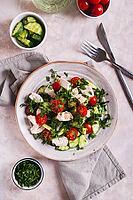 Fresh diet salad with chicken breast and vegetables on a plate on the table top and vertical view [IBR123629685]