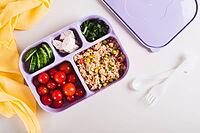 Homemade lunchbox with meat, vegetables and cereals for lunch at work on the table top view [IBR123629686]