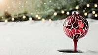 A bright red Christmas ornament ball bauble is placed in fresh snow on a snow-covered golf course. Soft glowing lights in the background. Snowflakes gently fall, creating a peaceful winter atmosphere during the evening. AI generated [IBR123641862]