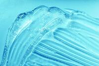 Gel texture. Blue gel sanitizer swatch. Antibacterial hygiene sanitiser splash. Skincare hydration product with aloe vera and collagen. Liquid clear jelly smear. Serum, shampoo or shaving cream smudge [IBR123646462]