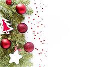 Christmas composition with decoration. Christmas balls, wooden tree, star, fir branches on white surface. Flat lay, top view, copy space, above [IBR123646484]