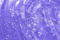 Skincare moisturizing product background. Liquid antibacterial disinfect smear smudge. Cosmetic lilac gel texture with bubbles. Hyaluronic acid clear serum sample. Sanitizer swatch. Close-up, macro [IBR123646517]