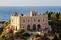 Tropea, Italy - 27.07.2023: Close-up view of Medieval monastery in Byzantine style, on steep rocky cliff overlooking sea. Sanctuary of Santa Maria dell'Isola di Tropea with visitors exploring the site [IBR123646526]