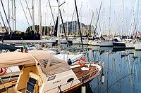 Castellammare del Golfo, Italy - 05.11.2022: Scenic marina with sailing boats and yachts docked in front of scenic mountainous backdrop [IBR123646528]