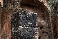 Rome, Italy - 09.12.2022: Ancient stone structure with weathered textures and mossy details in historical setting in Colosseum [IBR123646530]