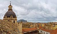 Palermo, Italy - 06.11.2022: Chiesa di Santa Caterina d'Alessandria, Chiesa Santa Chiara. Historic cityscape with rooftops and cathedral dome under cloudy skies [IBR123646535]