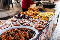 Palermo, Italy - 06.11.2022: Vibrant mexican street food market with assorted traditional dishes displayed on vendor stall [IBR123646541]