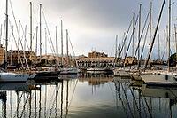 Castellammare del Golfo, Italy - 05.11.2022: Marina with sailboats in tranquil evening light, perfect for nautical decor or travel inspiration [IBR123646546]