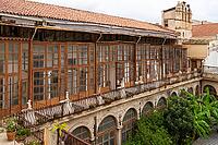 Palermo, Italy - 06.11.2022: Historic colonial architecture with wooden balconies and lush courtyard. Chiostro con fontana di San Domenico [IBR123646551]