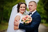 Wedding couple walking at green park [IBR123675070]