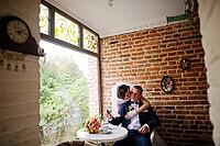Wedding couple at vintage cafe at autumn day [IBR123675112]