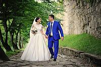 Young wedding couple in love on their wedding day [IBR123675128]