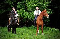 Young couple on national dress with horses [IBR123675144]
