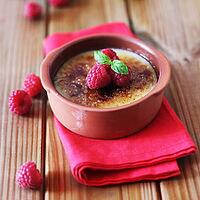Creme Brulee with Raspberries On A Wooden Background [IBR123700035]