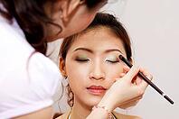 Woman applying cosmetic with applicator. Make-up treatment [IBR123713329]