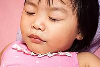 Sleeping Asian child having a sweet dream [IBR123713368]