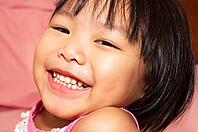 Close-up shot of a young Asian girl with smile on her face [IBR123713373]