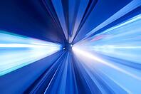 Speedy train moving fast into blue tunnel [IBR123713377]