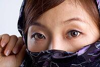 Close-up of a islamic woman covered with veil [IBR123713391]