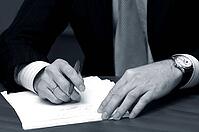Hand of the businessman with pen [IBR123723138]