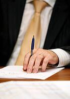 Hand of the businessman with pen [IBR123723139]